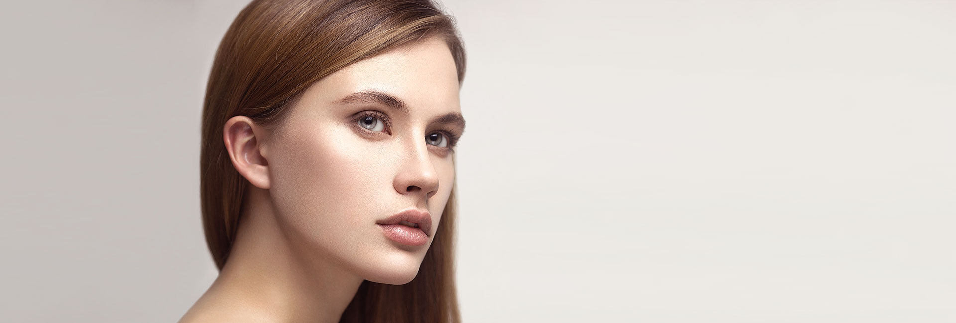 Face of woman with long brown hair