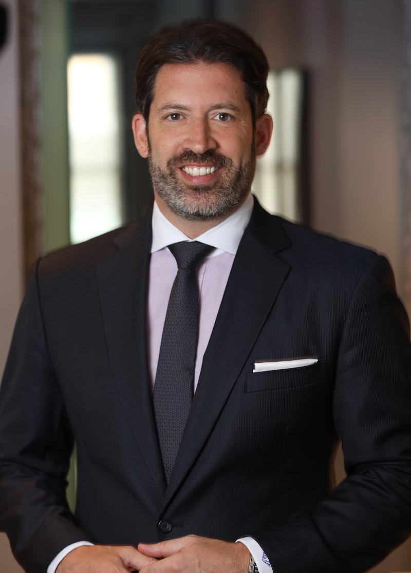 Dr. Cangello in a grey suit
