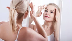 older woman looking in the mirror