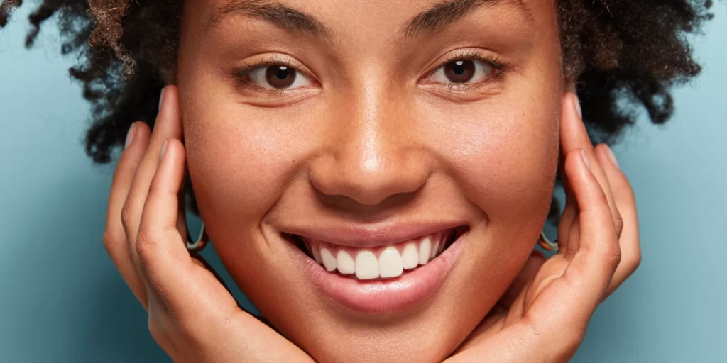 woman smiling with nose tip procedure